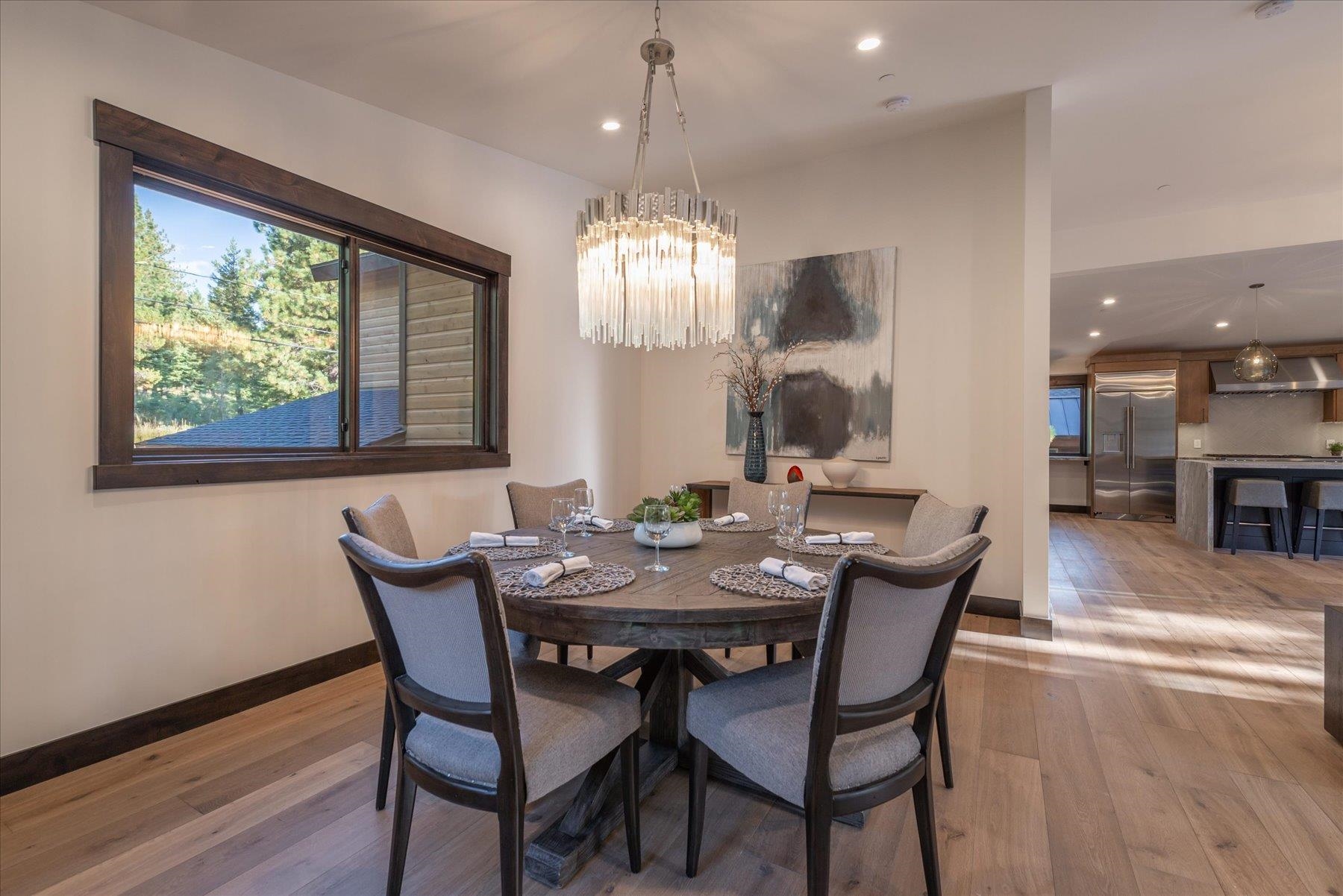 15330 Wolfgang Road Truckee, CA 96161 - Photo 6 of 21 a view of a dining room with furniture window and wooden floor