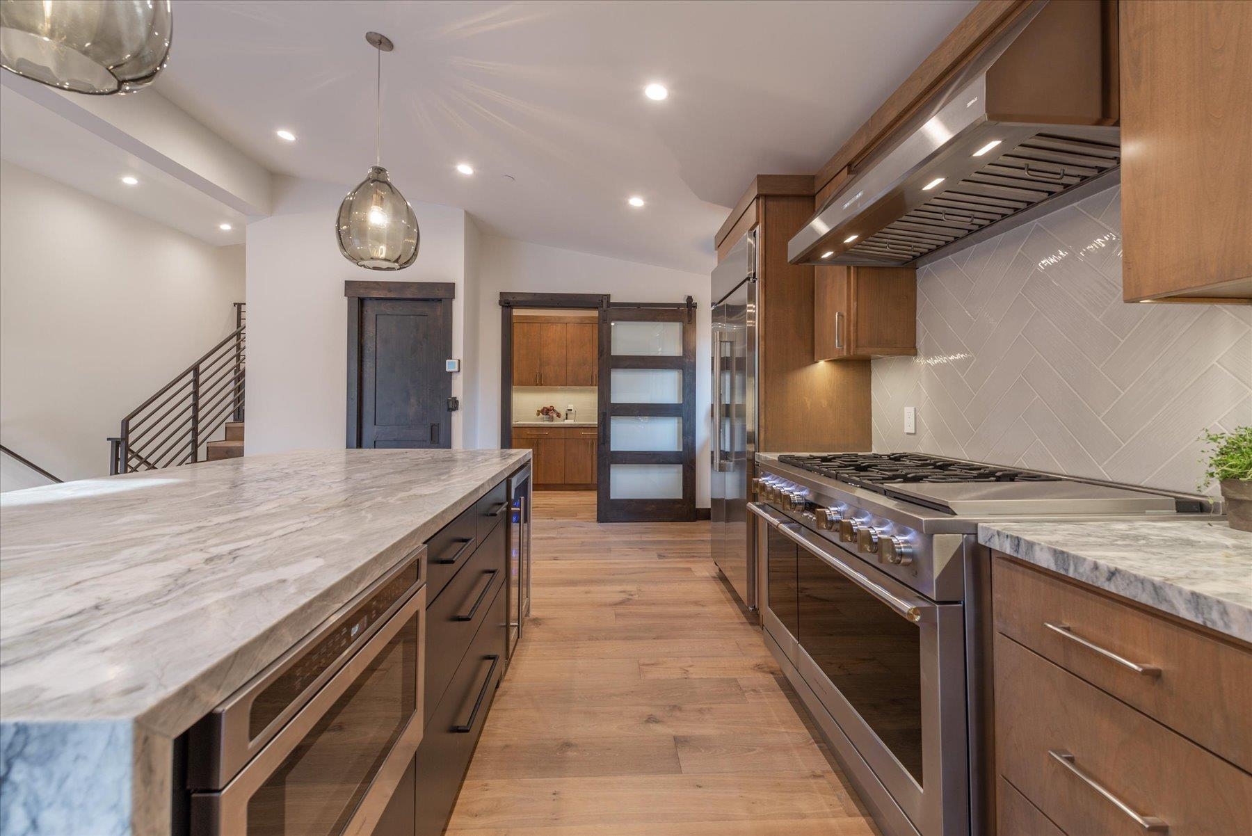 15330 Wolfgang Road Truckee, CA 96161 - Photo 9 of 21 a open kitchen with stainless steel appliances granite countertop a stove and a wooden floors