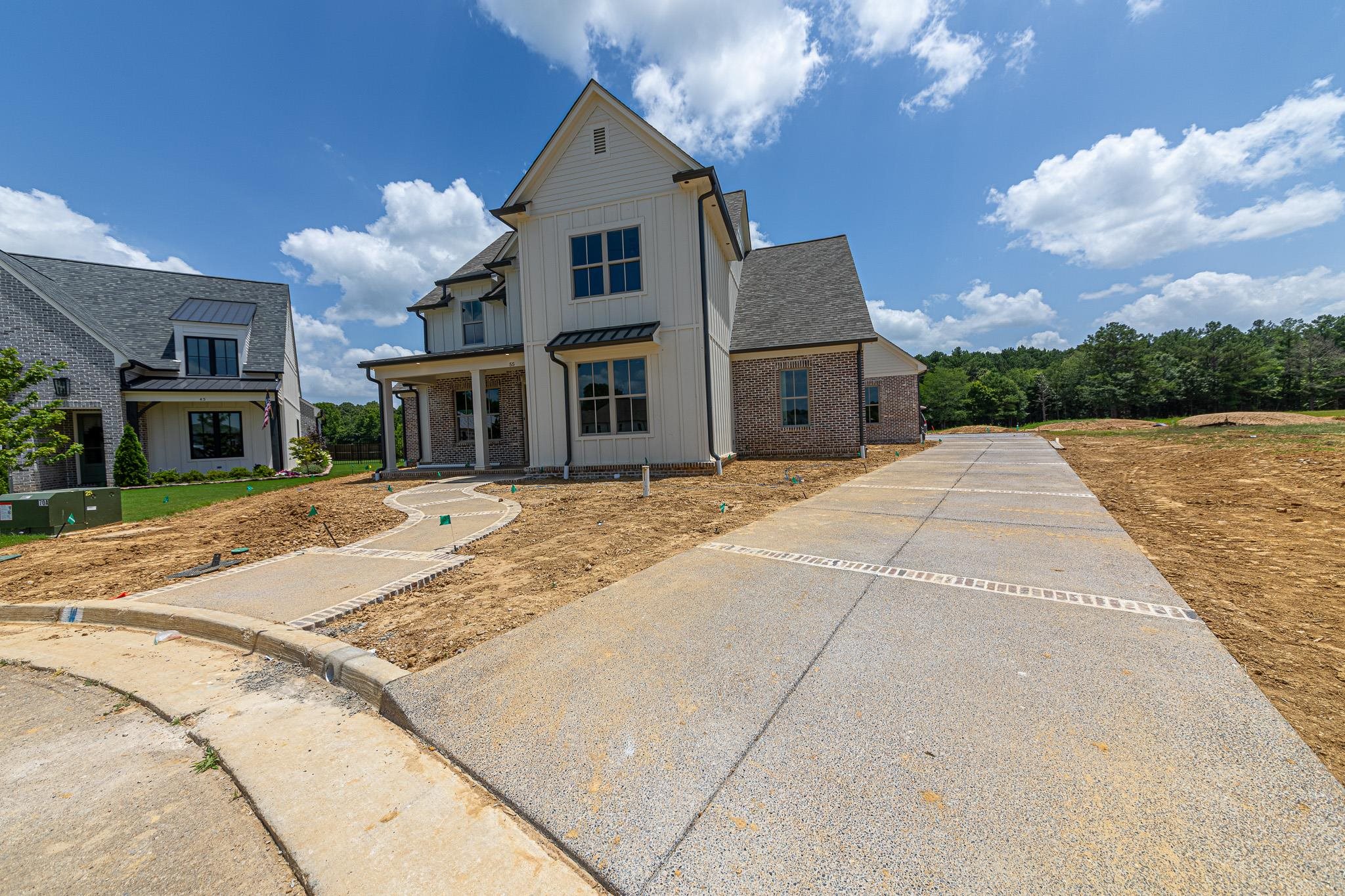 55 New Pond Road Piperton, TN 38017 - Photo 2 of 4 Two-story residence featuring a combination of light-colored vertical siding and brick veneer