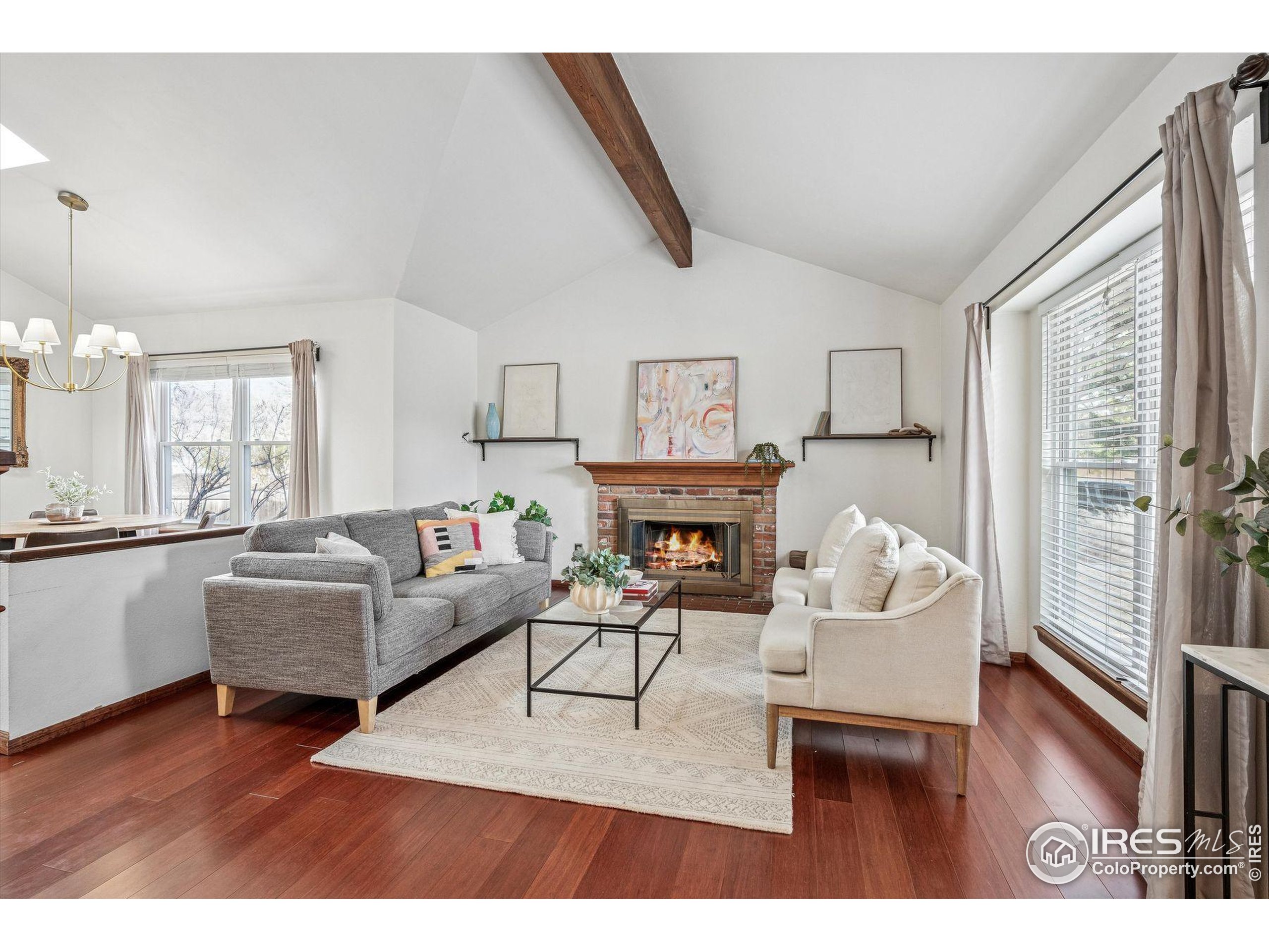 4541 Ensenada Street Denver, CO 80249 - Photo 11 of 35 a living room with fireplace furniture and a wooden floor