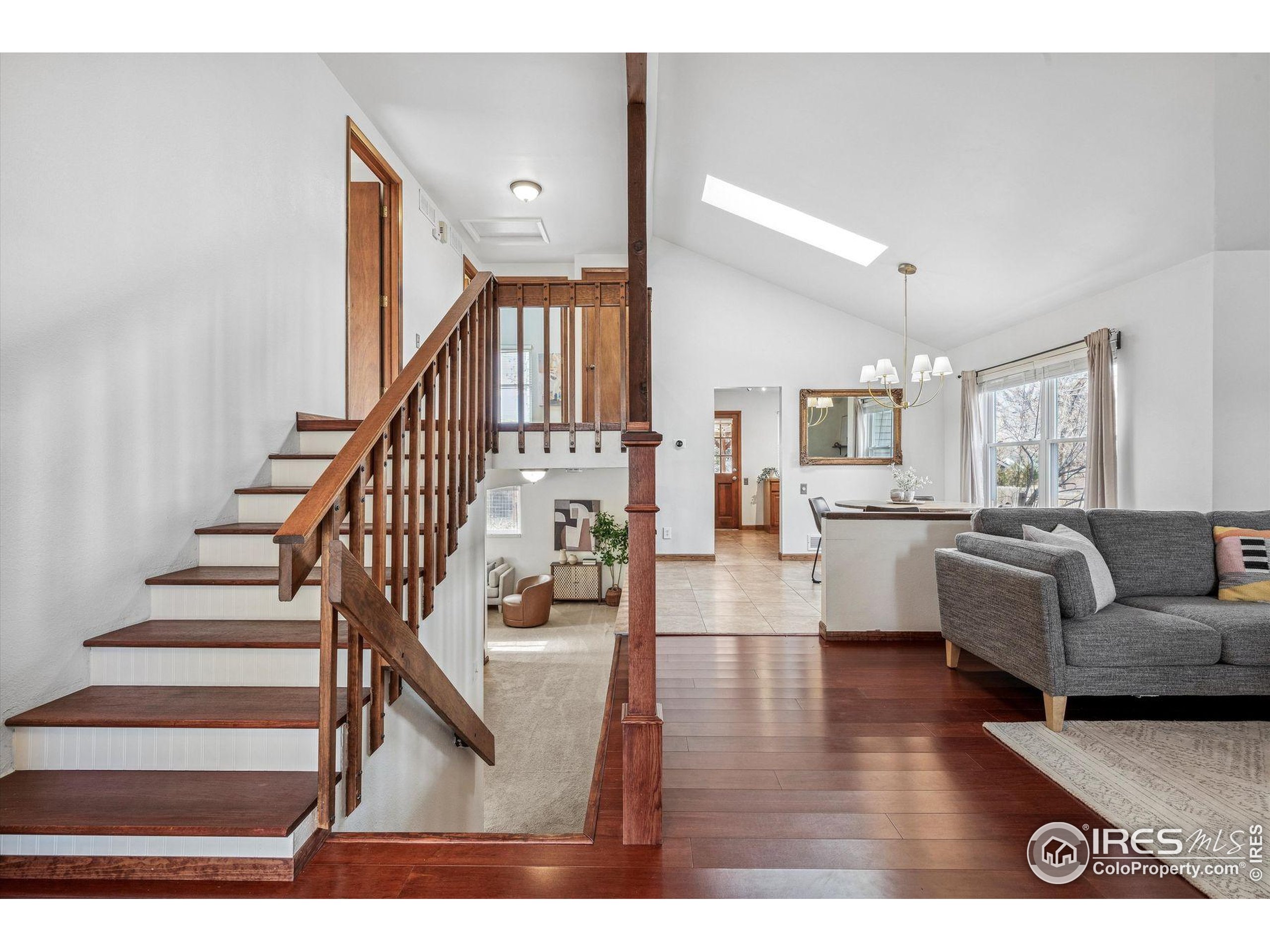 4541 Ensenada Street Denver, CO 80249 - Photo 2 of 35 a living room with furniture and wooden floor