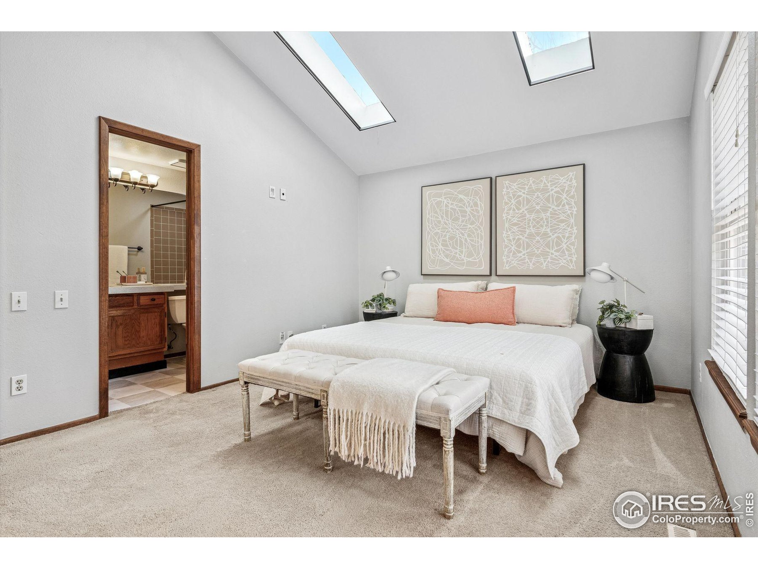 4541 Ensenada Street Denver, CO 80249 - Photo 21 of 35 a bedroom with a bed and a table