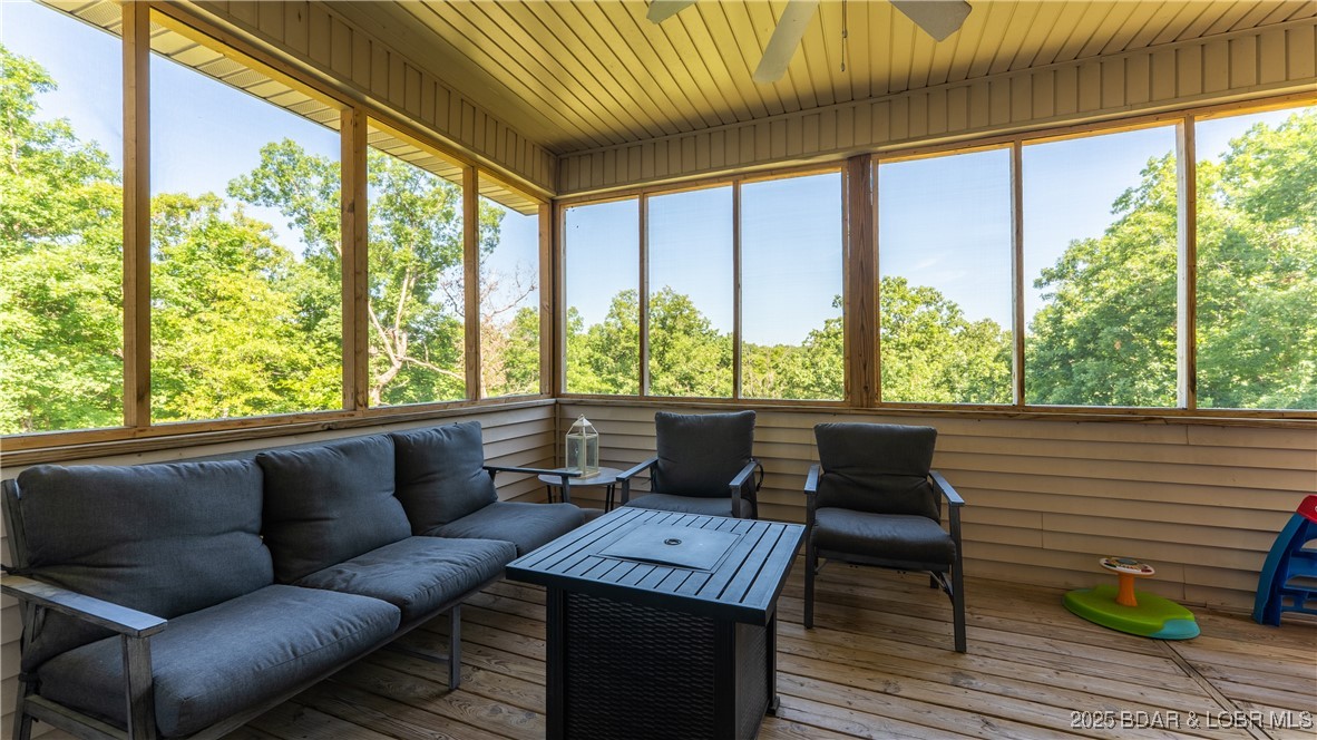 21 Winston Lane Kaiser, MO 65047 - Photo 6 of 43 Large covered and screened porch is perfect for en