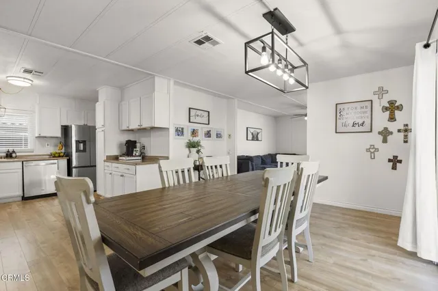 a kitchen with cabinets appliances a sink and a counter top