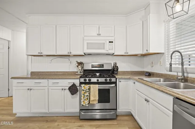 a workspace with furniture and wooden floor