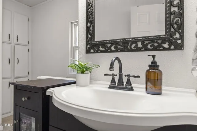 a view of backyard with a garden and entertaining space