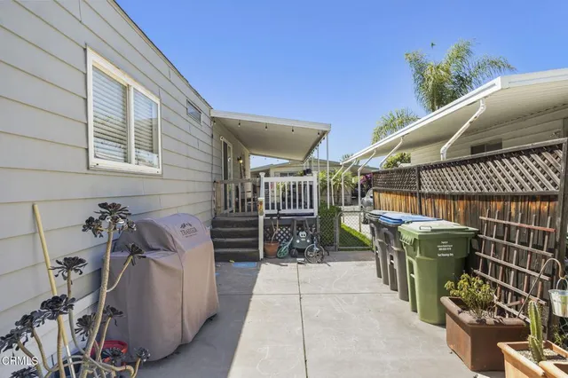 a living room with furniture pool table and window