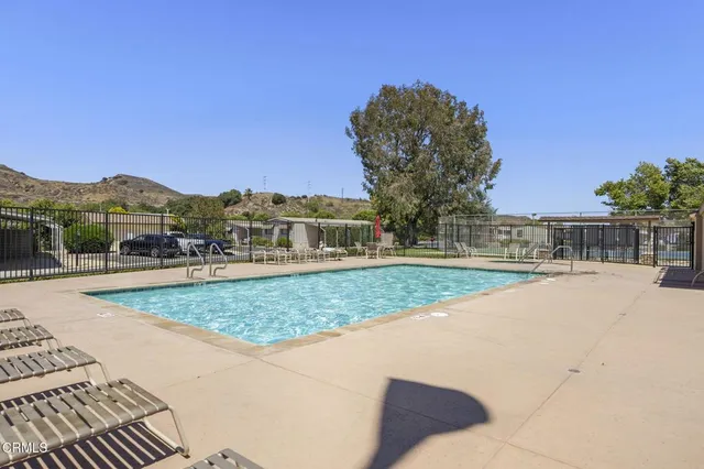 a view of a livingroom with furniture and staircase