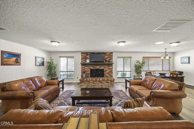a view of a house with sitting area and garden