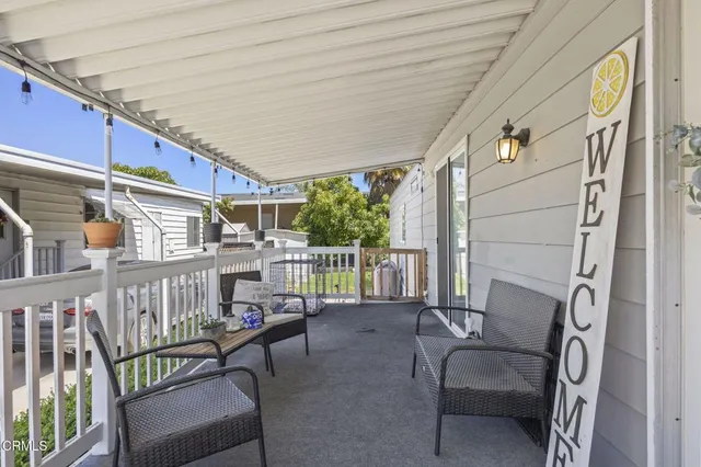 a living room with a couch and a window