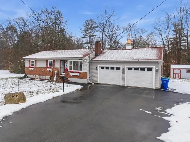 a view of a large house with a large space and large trees