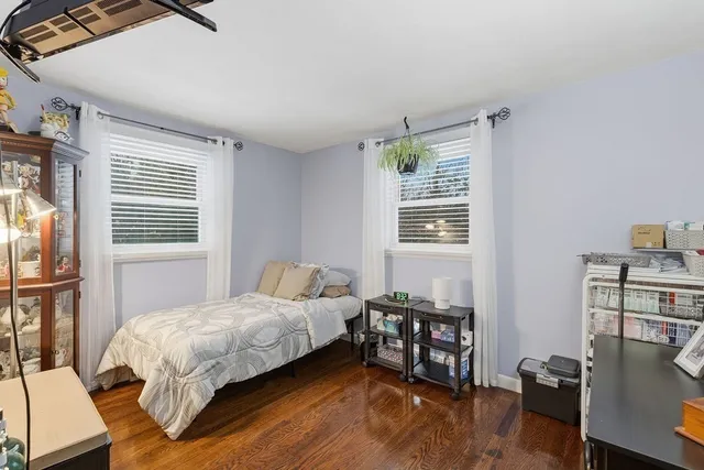 a bedroom with a bed furniture and a window