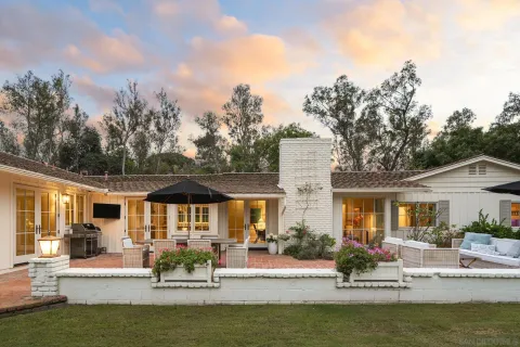 a view of a house with swimming pool and porch