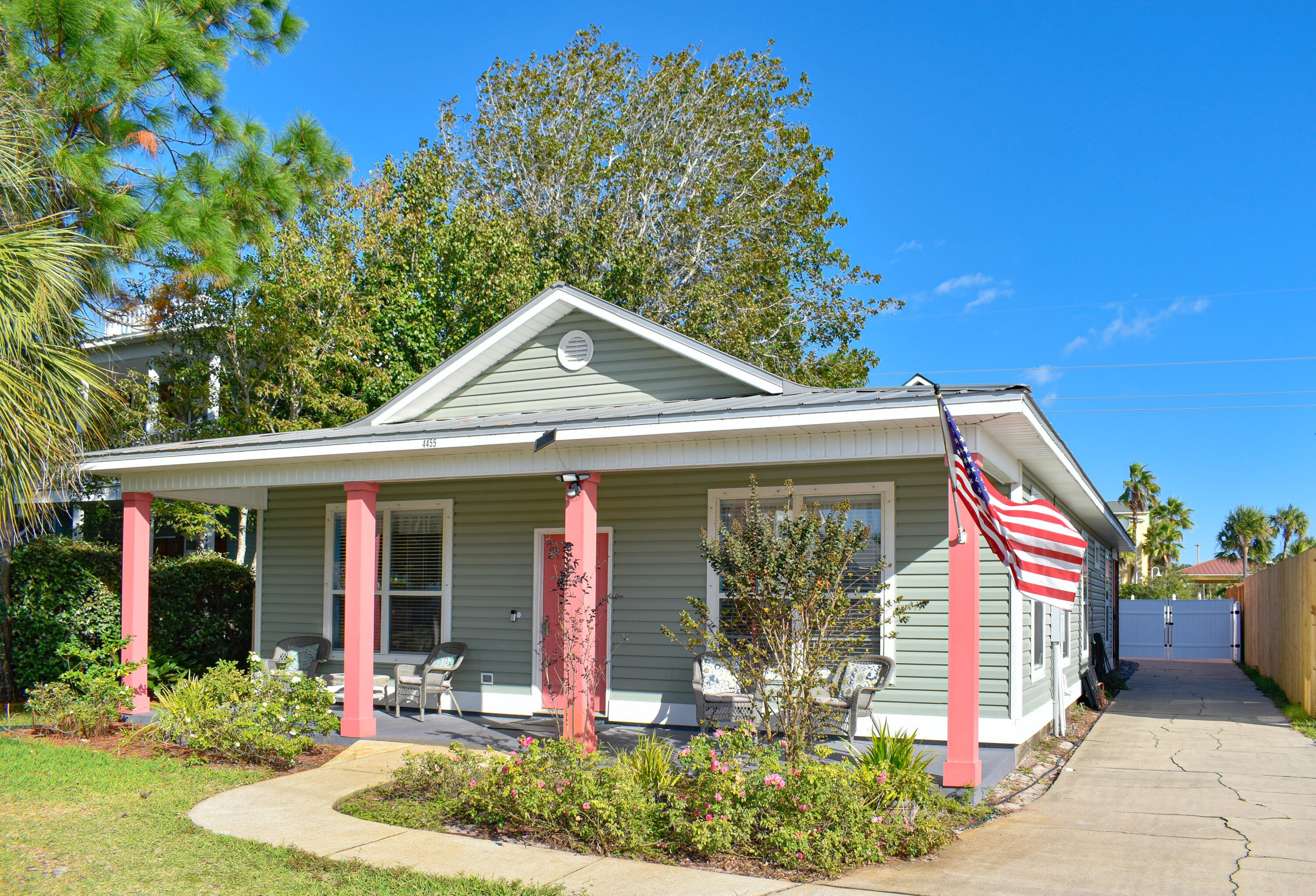 4455 Luke Avenue Destin, FL 32541 - Photo 2 of 44 a front view of a house with garden