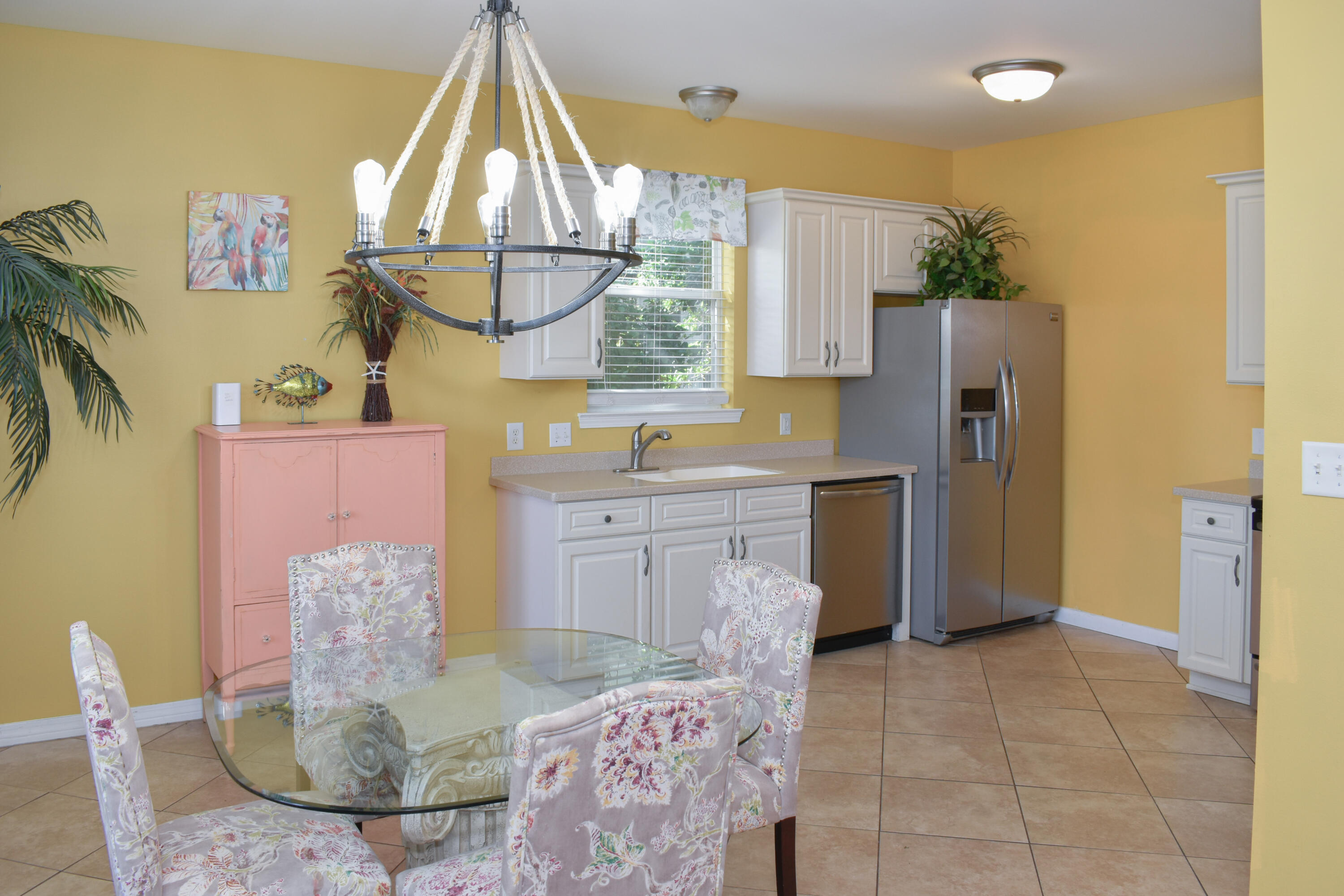 4455 Luke Avenue Destin, FL 32541 - Photo 15 of 44 a kitchen with a sink cabinets and window