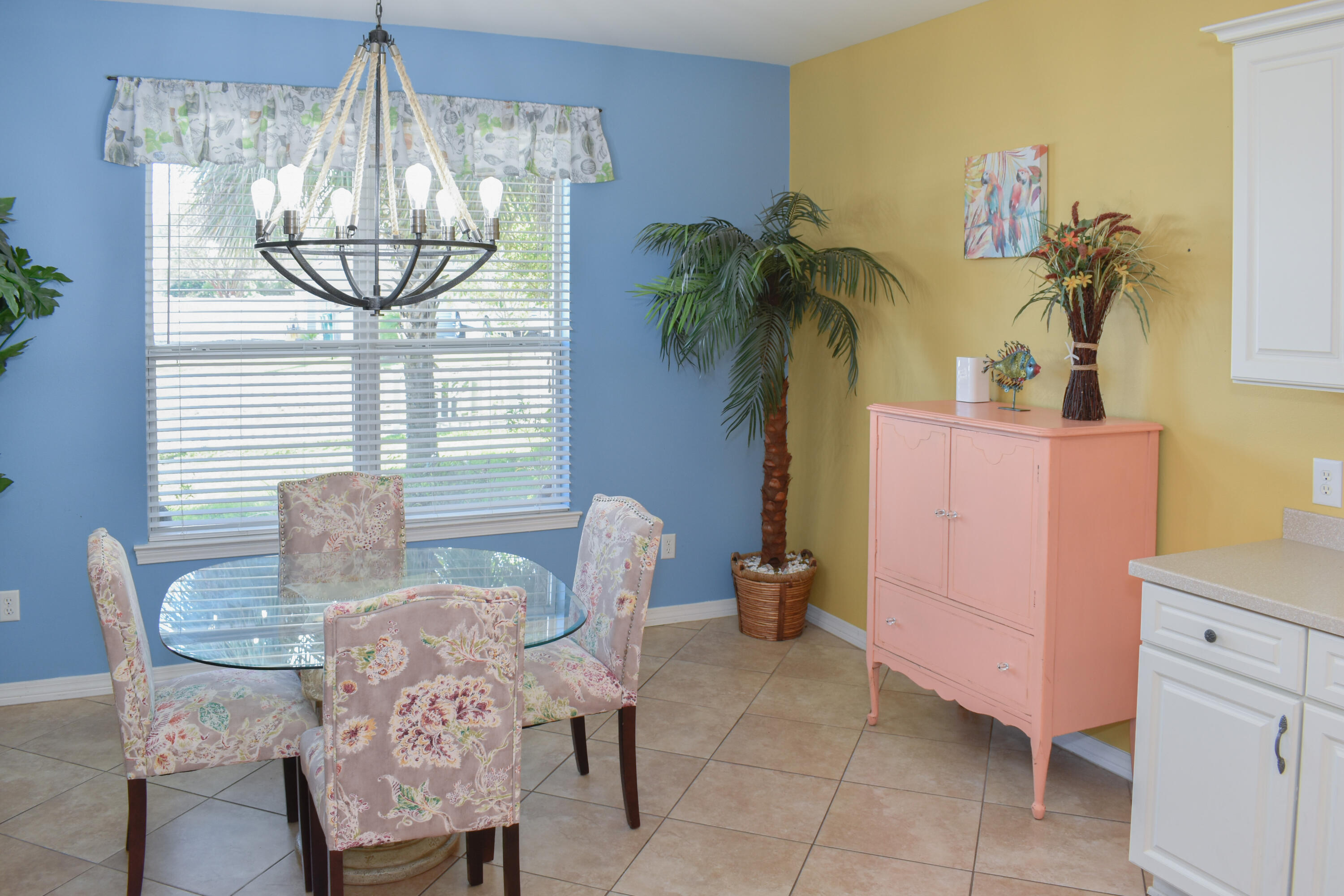 4455 Luke Avenue Destin, FL 32541 - Photo 18 of 44 a view of a dining room with furniture and chandelier