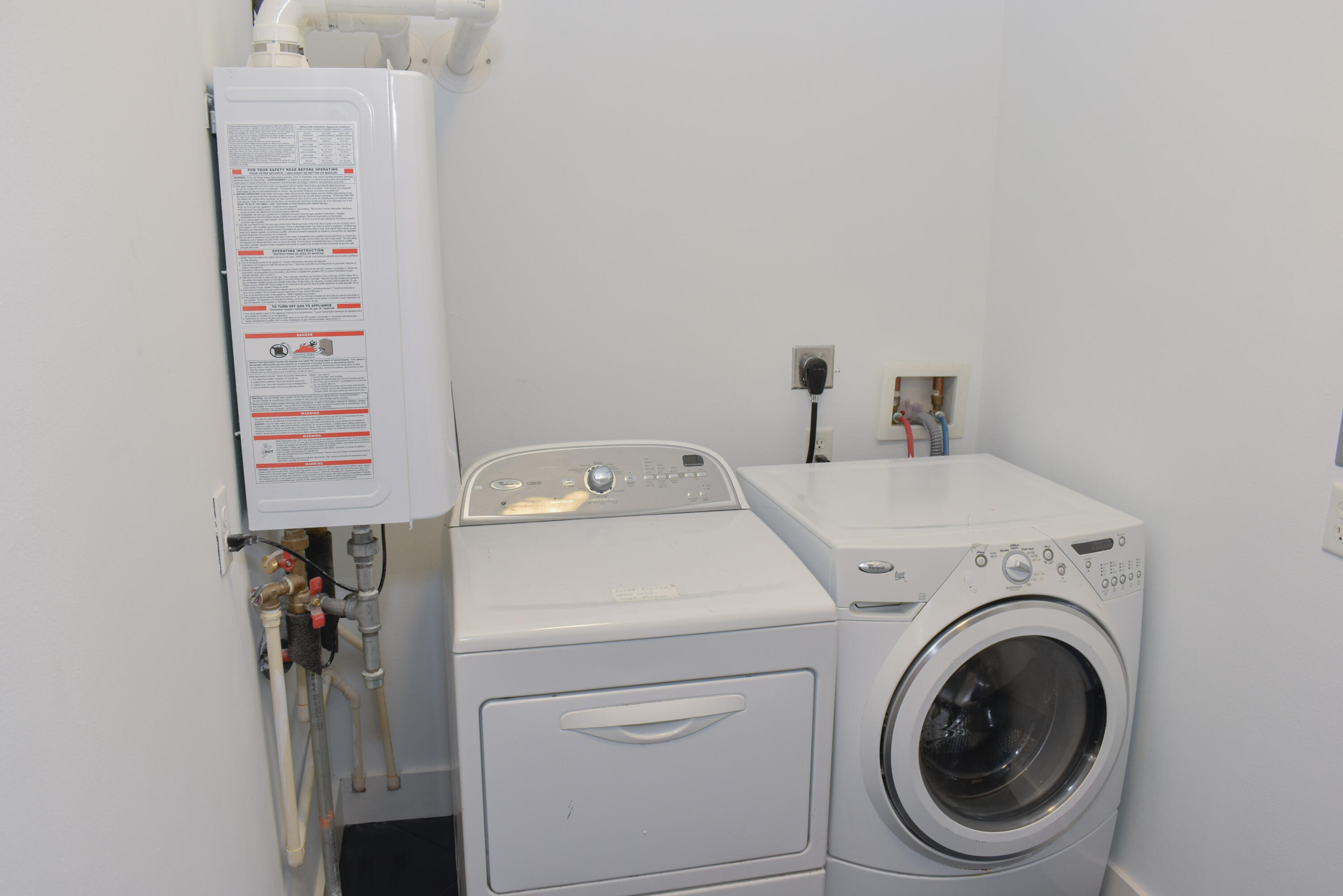 4455 Luke Avenue Destin, FL 32541 - Photo 24 of 44 a utility room with dryer and washer