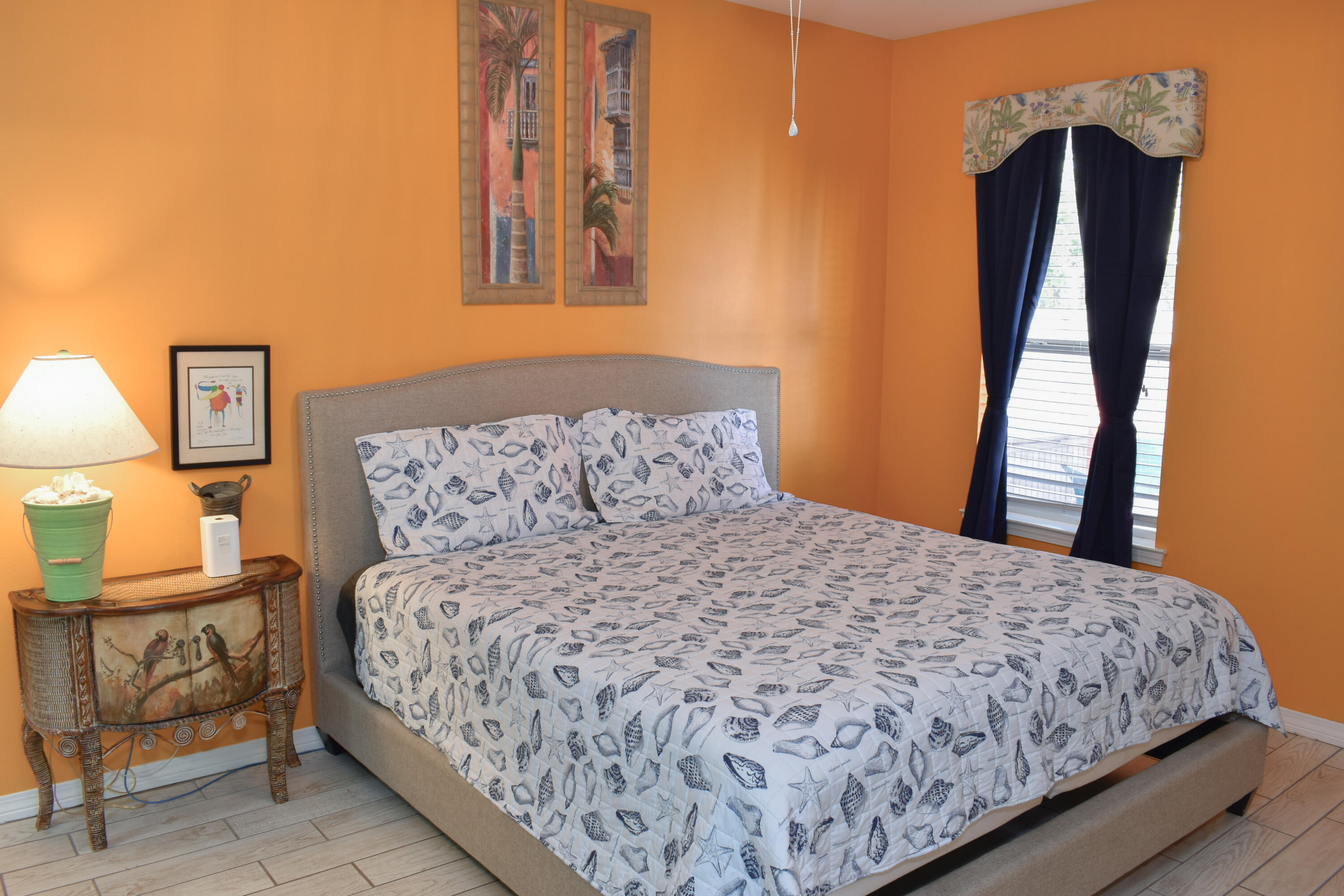 4455 Luke Avenue Destin, FL 32541 - Photo 27 of 44 a bedroom with a bed and wooden floor