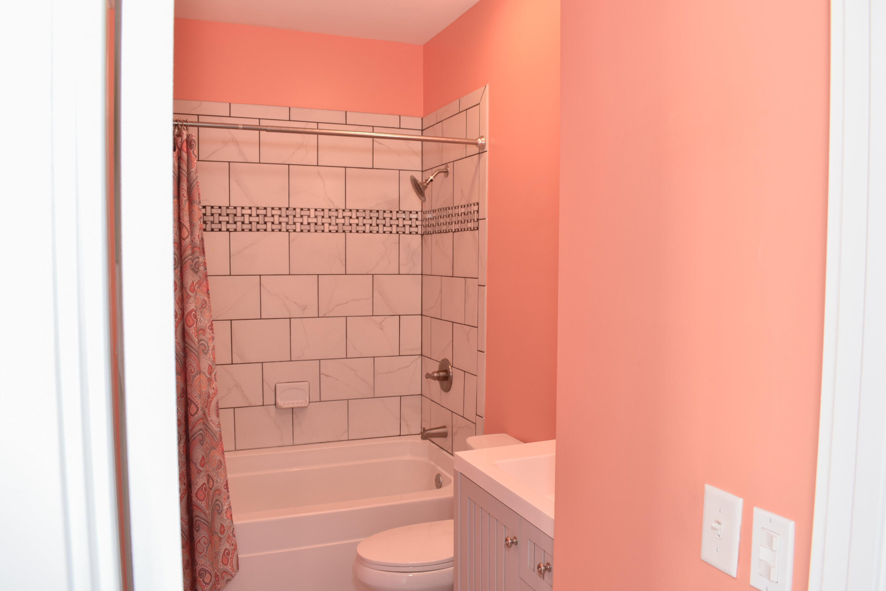 4455 Luke Avenue Destin, FL 32541 - Photo 42 of 44 a bathroom with a bathtub and shower