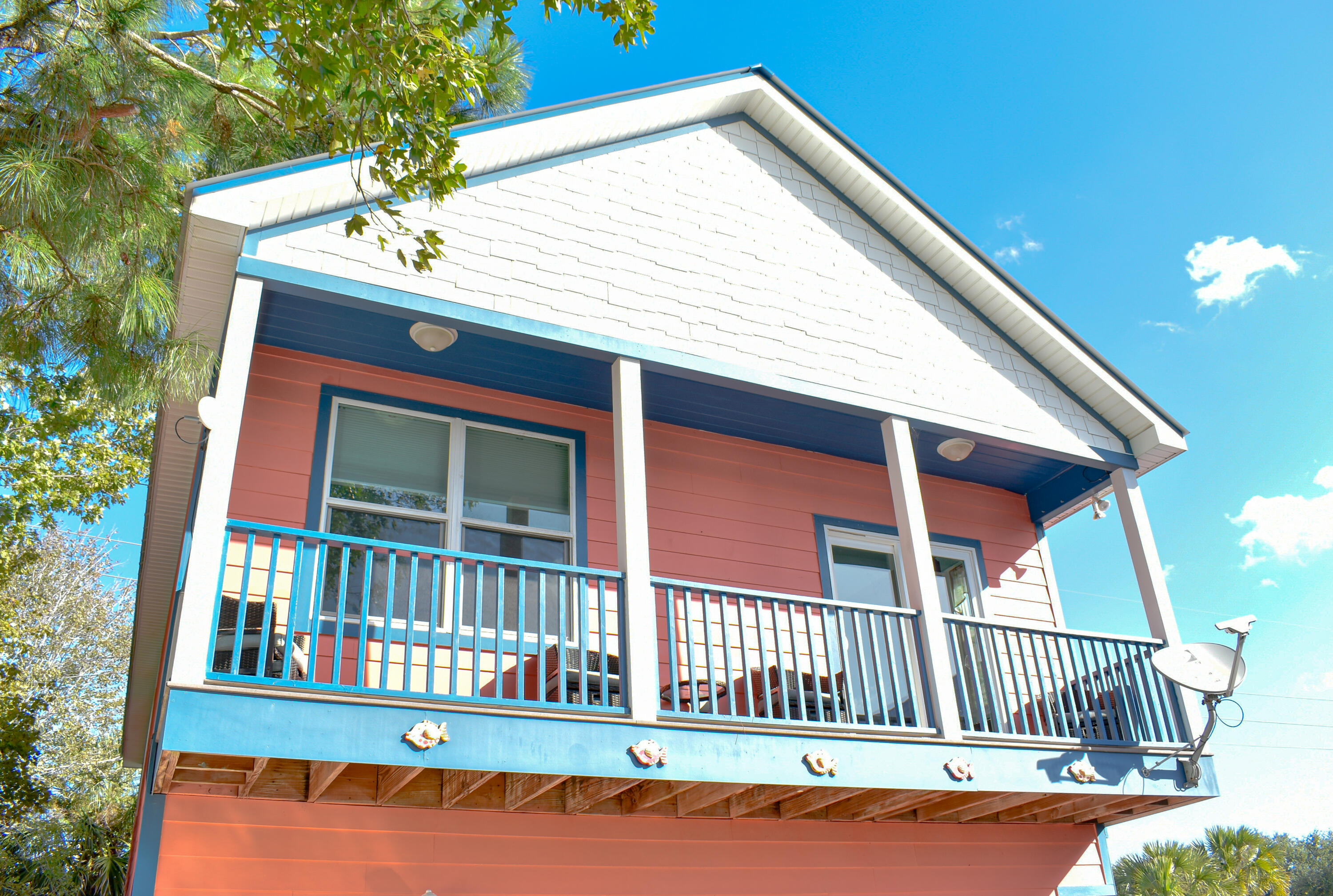 4455 Luke Avenue Destin, FL 32541 - Photo 7 of 44 a view of a house with a deck and a yard