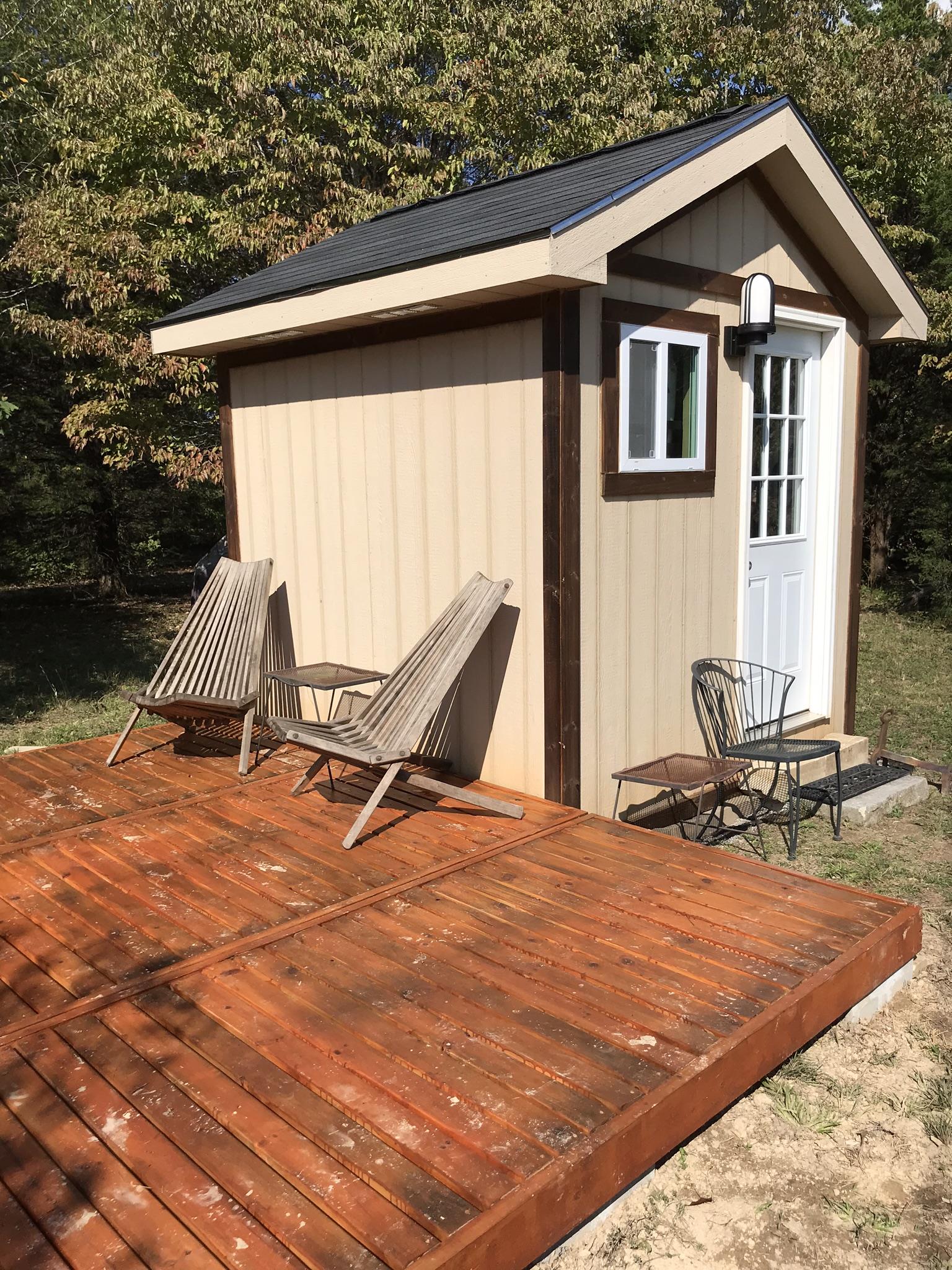 9400 Warf Road Primm Springs, TN 38476 - Photo 14 of 23 a backyard of a house with table and chairs