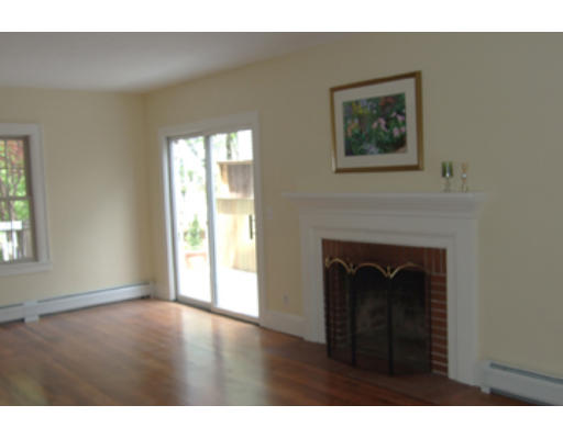 114 Maple Road Longmeadow, MA 01106 - Photo 3 of 9 a living room with a fireplace and a window