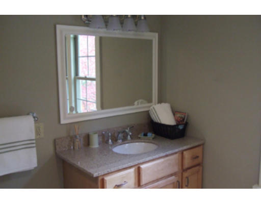 114 Maple Road Longmeadow, MA 01106 - Photo 4 of 9 a bathroom with a sink vanity granite and a mirror