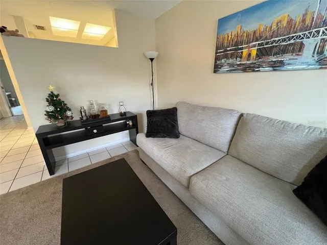 a living room with furniture and a couch