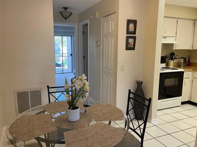 a kitchen with a table and chairs in it