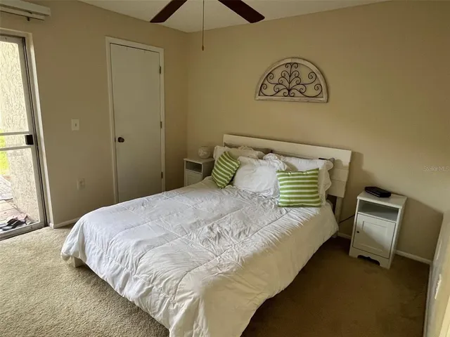 a bedroom with a bed and cabinets