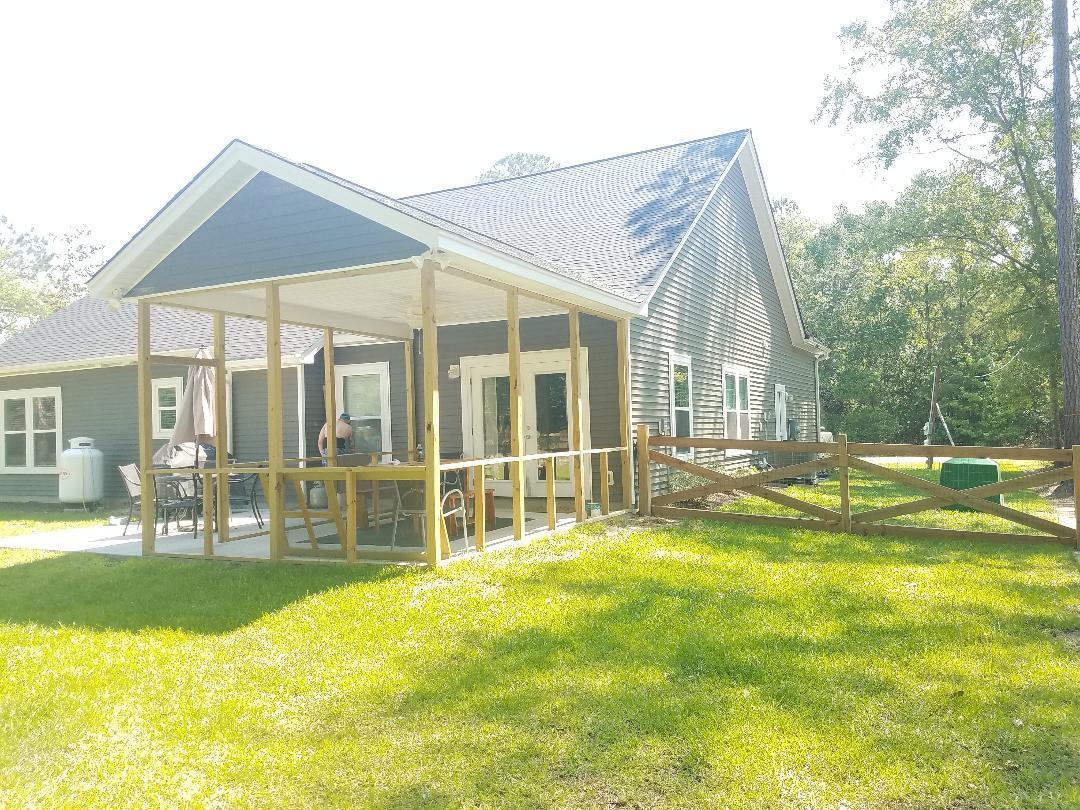 5843 Yellow Dog Road Ravenel, SC 29470 - Photo 7 of 31 screened in porch on rear