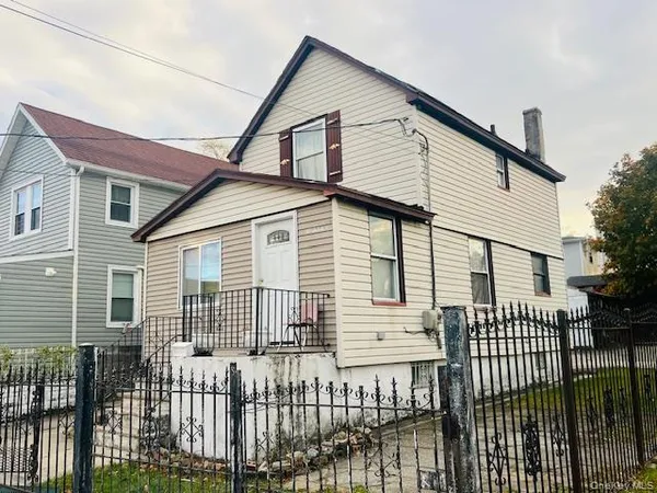 a front view of a house with a porch