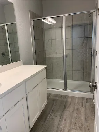 a bathroom with a bathtub and a shower