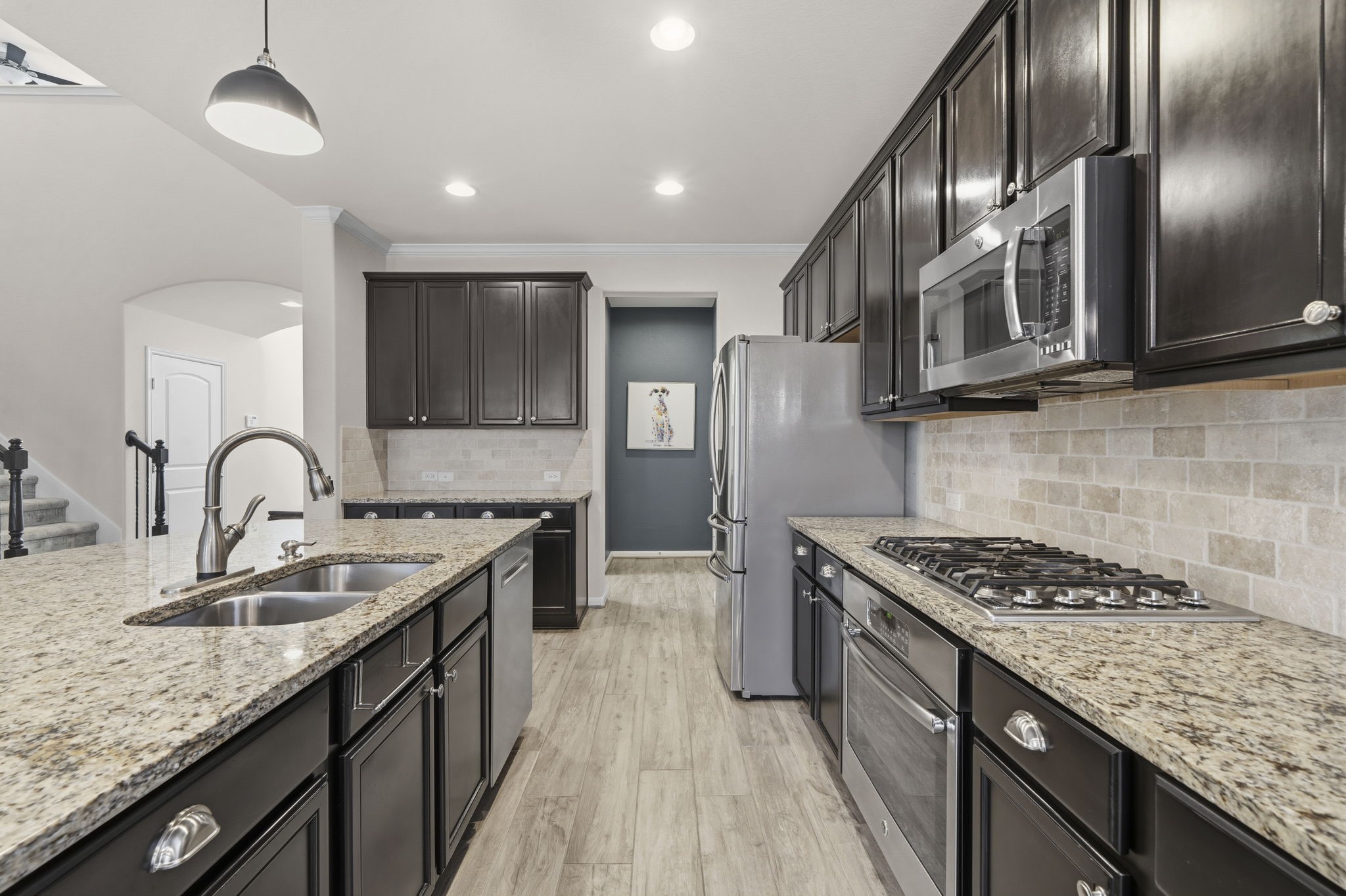 16731 Doubletree Ranch Drive Cypress, TX 77433 - Photo 11 of 44 The kitchen features Viking cooktop, Delta Touch faucet and Bosch dishwasher.