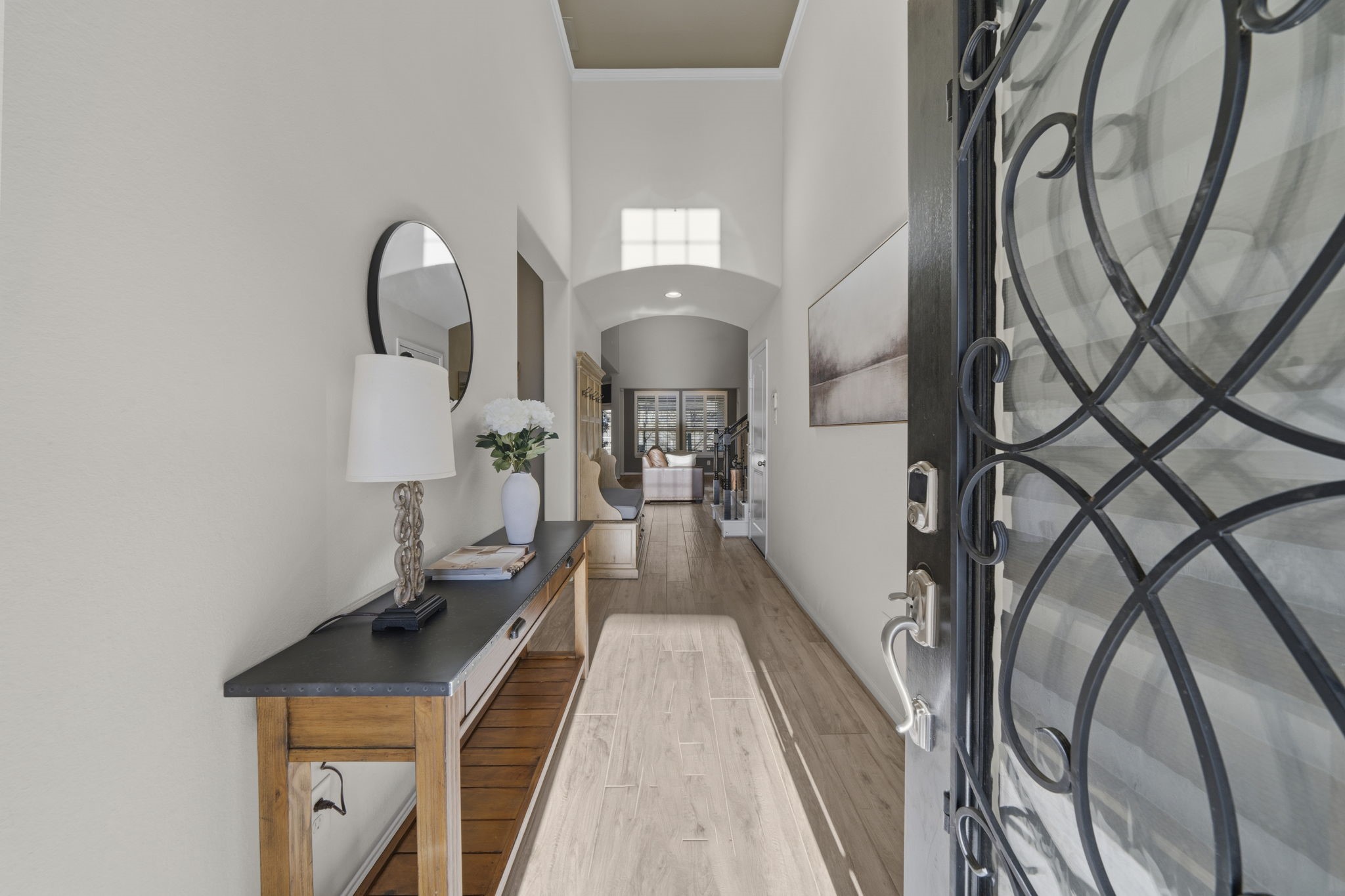 16731 Doubletree Ranch Drive Cypress, TX 77433 - Photo 2 of 44 Welcoming entryway with high ceilings, crown molding, wood-look porcelain tile flooring and a glass door with wrought iron.