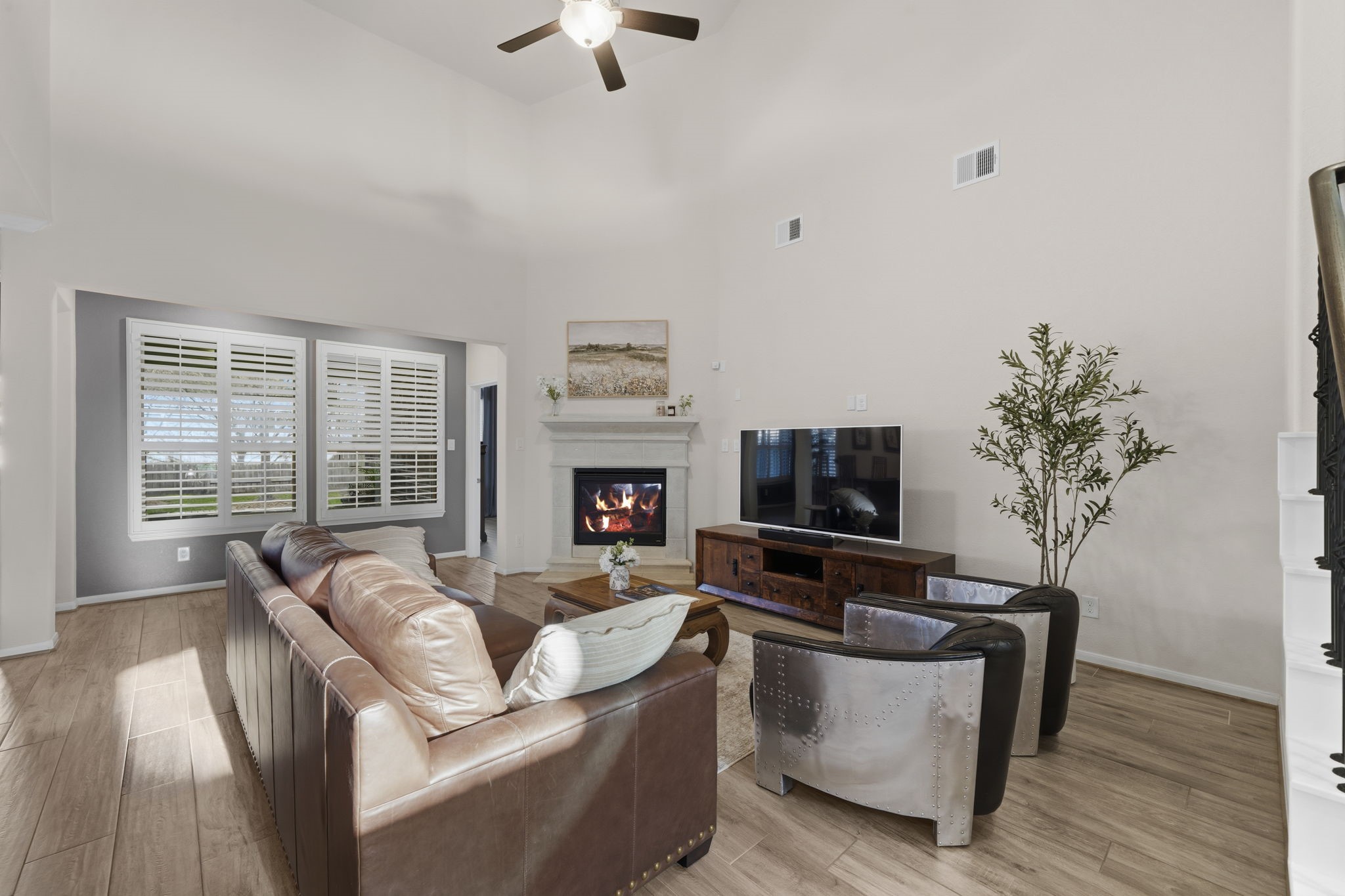 16731 Doubletree Ranch Drive Cypress, TX 77433 - Photo 8 of 44 Cozy living room framed by elegant plantation shutters.