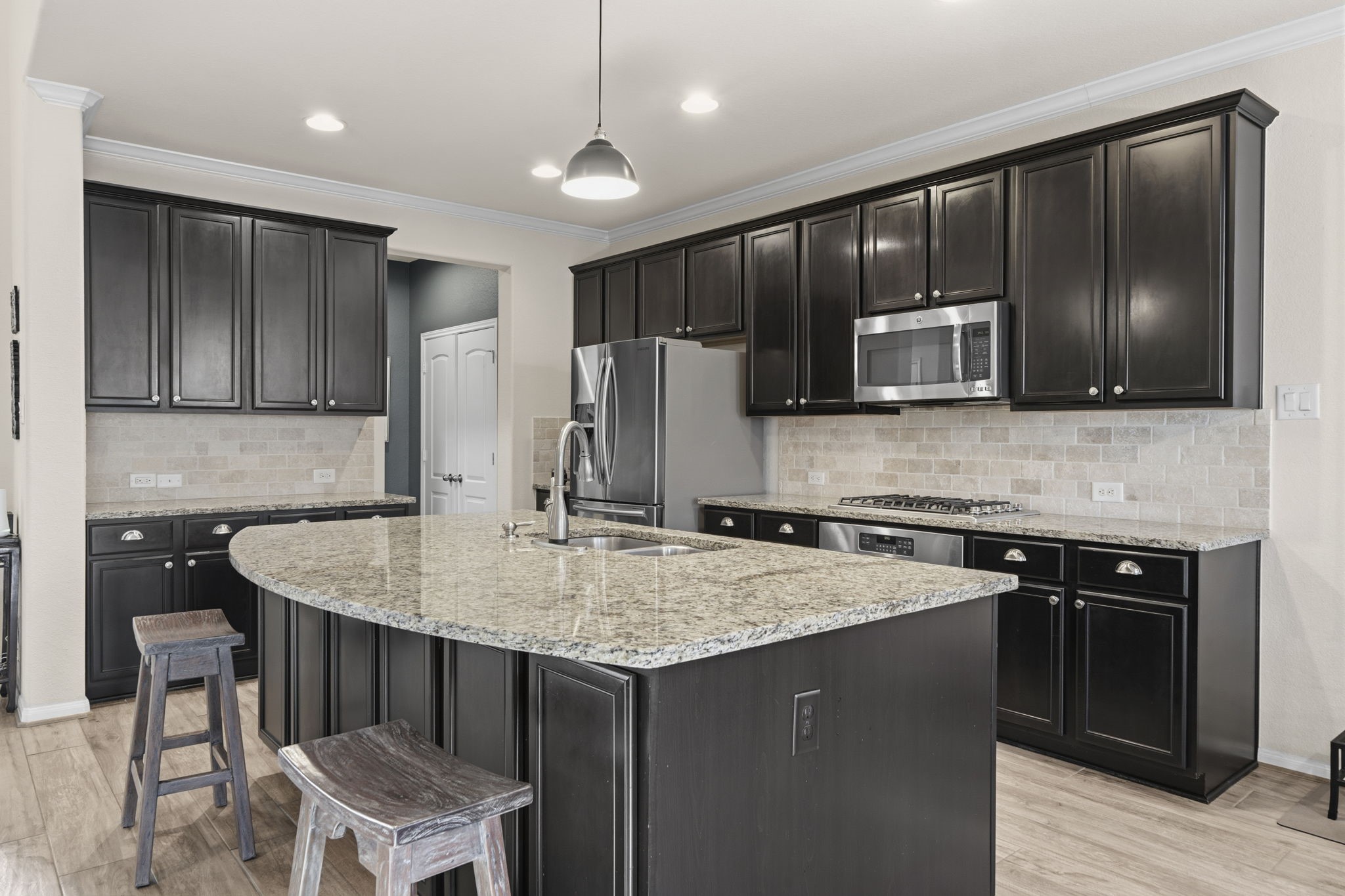 16731 Doubletree Ranch Drive Cypress, TX 77433 - Photo 10 of 44 Kitchen offering ample storage space and large island for gatherings.