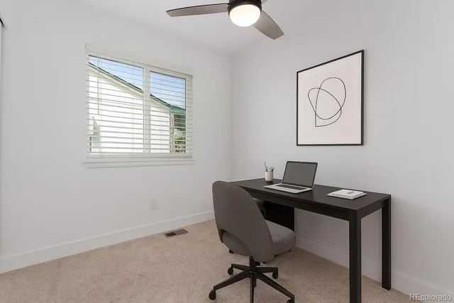 a view of a workspace with furniture