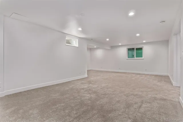 an empty room with a empty space and window