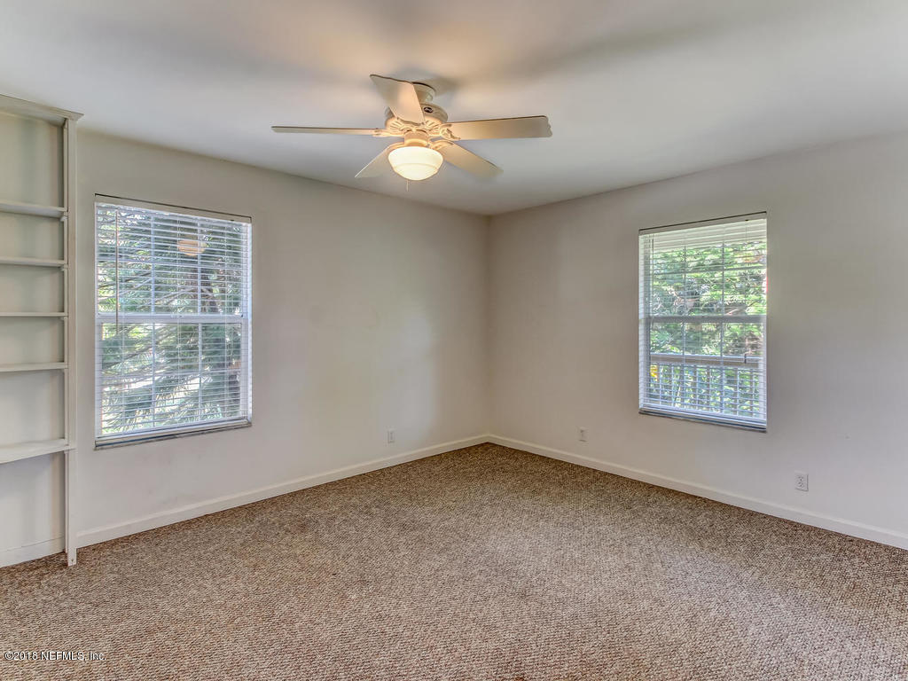 6332 Salado Road St. Augustine, FL 32080 - Photo 27 of 57 an empty room with windows and fan