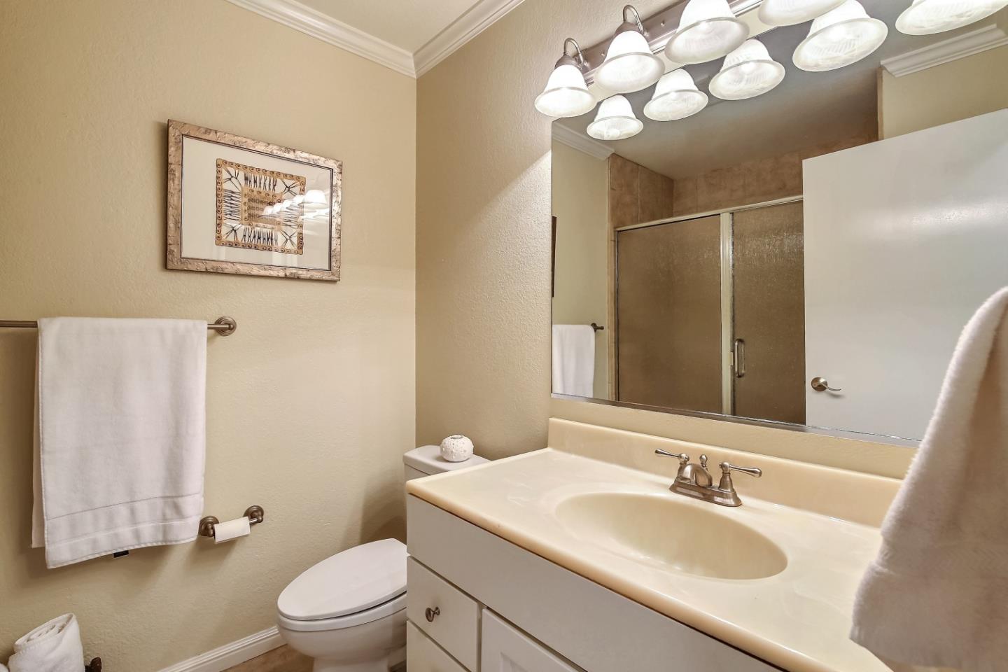 Braddock Court San Jose, CA 95125 - Photo 17 of 20 a bathroom with a sink vanity mirror and toilet