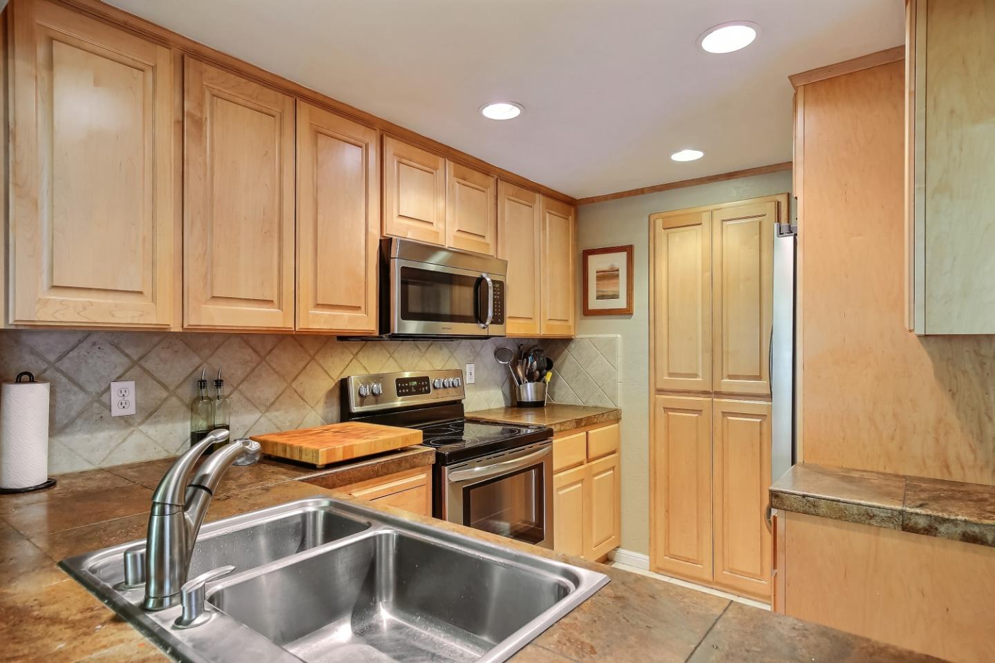 Braddock Court San Jose, CA 95125 - Photo 9 of 20 a kitchen with stainless steel appliances granite countertop a refrigerator and a stove top oven