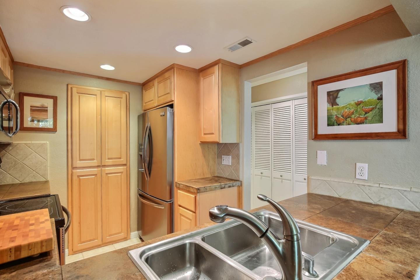 Braddock Court San Jose, CA 95125 - Photo 10 of 20 a kitchen with a refrigerator sink and cabinets