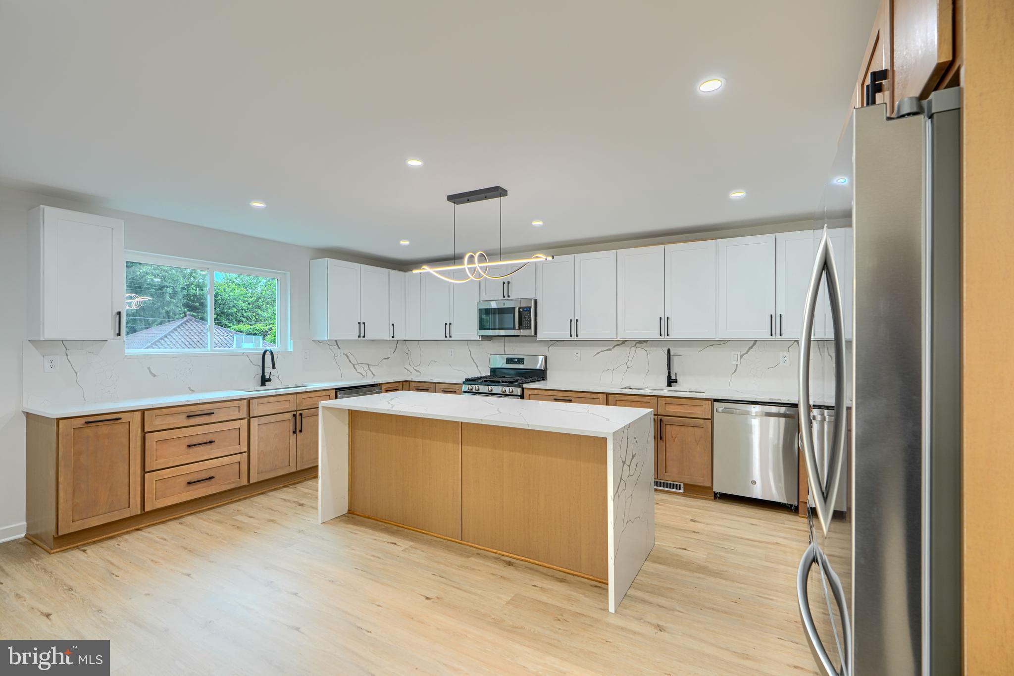 3410 Pinkney Road Baltimore, MD 21215 - Photo 3 of 55 a kitchen with a sink stainless steel appliances and cabinets