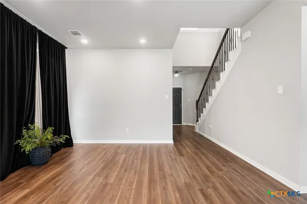 a view of entryway with wooden floor