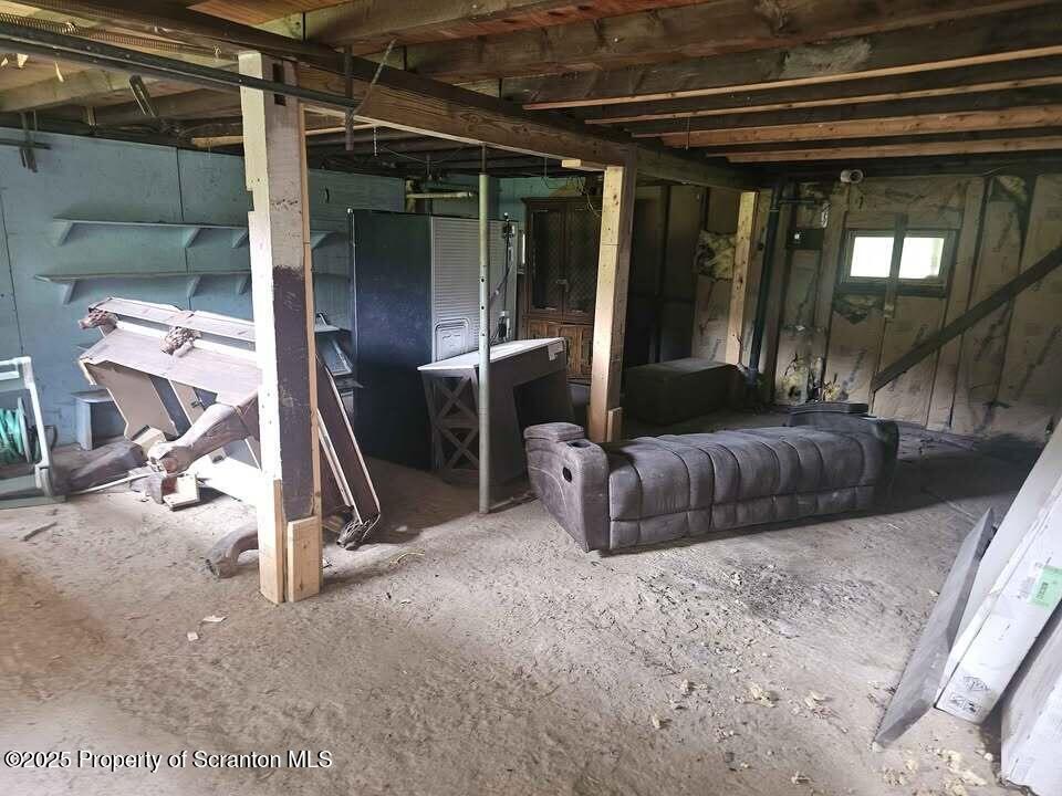 68 Oxbow Road Union Dale, PA 18470 - Photo 15 of 20 a living room with a couch and a glass door
