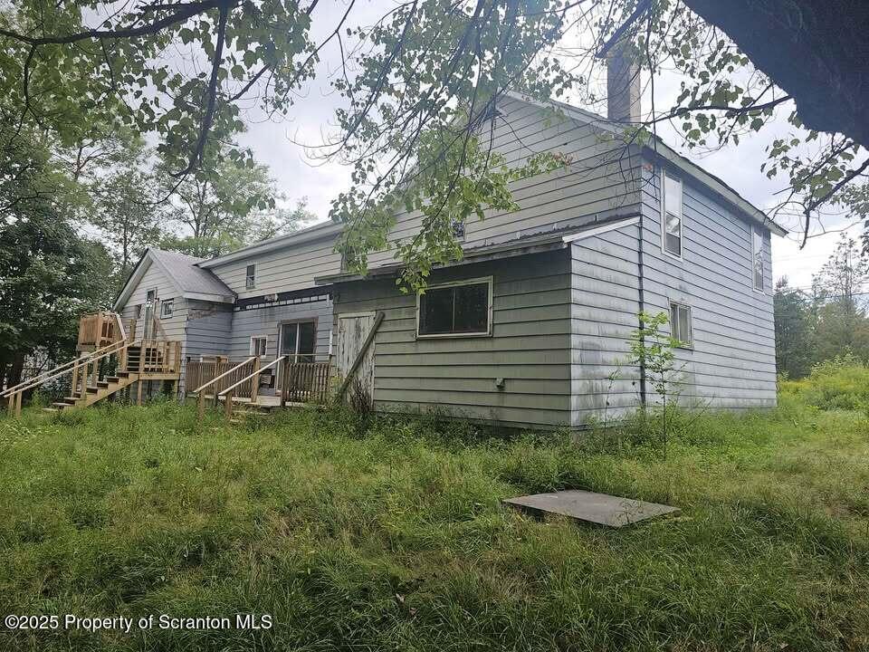 68 Oxbow Road Union Dale, PA 18470 - Photo 2 of 20 a view of a back yard of the house
