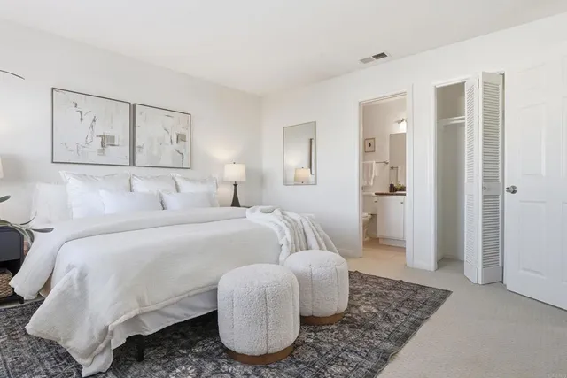 a bedroom with a bed and couch