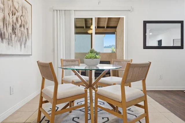 a view of a dining room with furniture and window