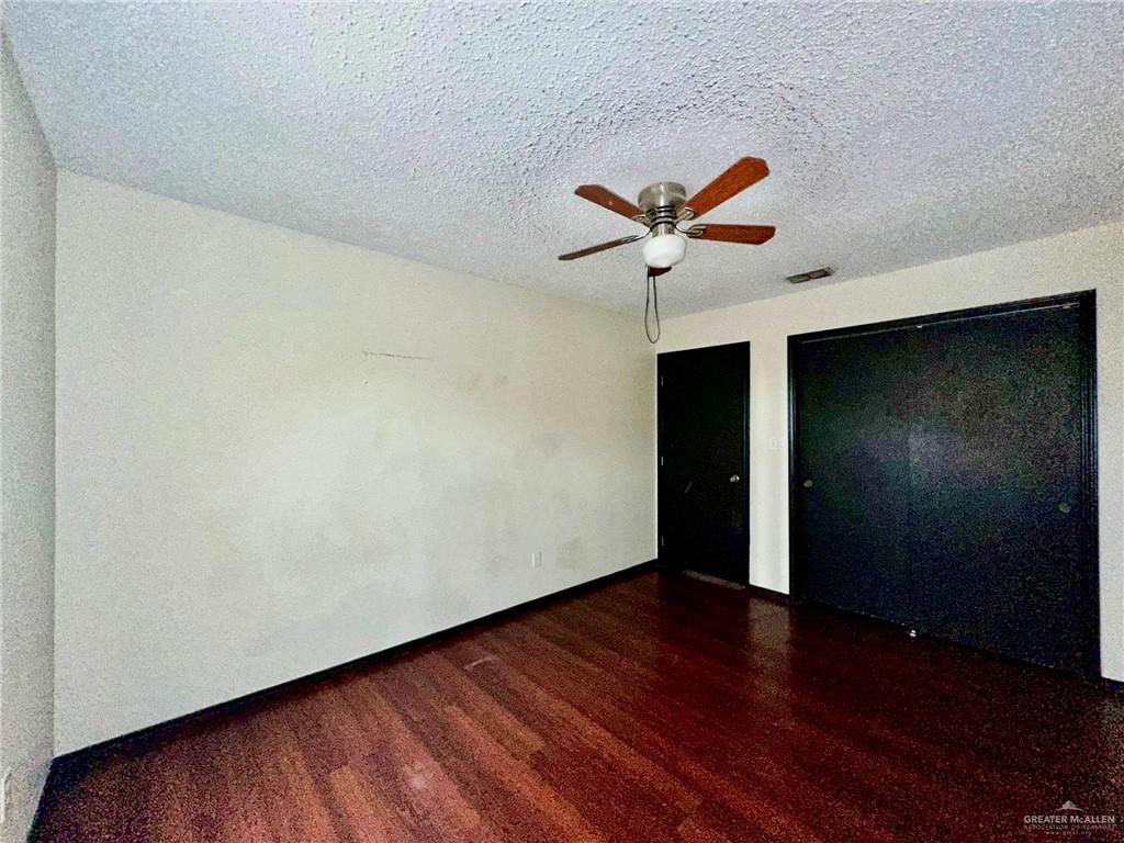 2109 Umar Avenue McAllen, TX 78504 - Photo 21 of 25 wooden floor in an empty room